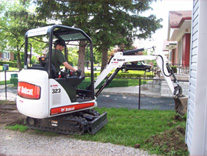 Bobcat Removing Grass Bobcat Removing Grass